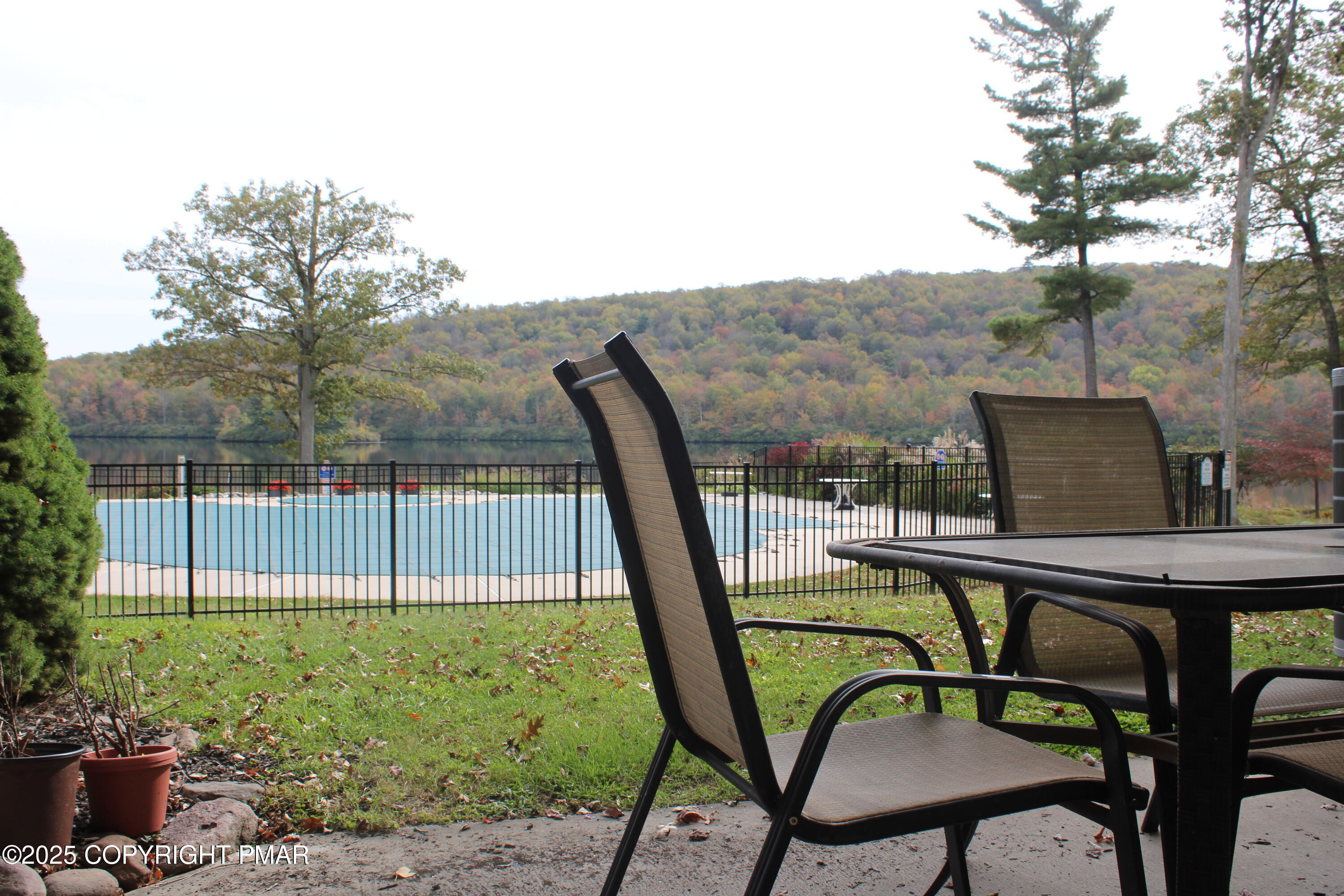 33 Midlake Drive, Unit 101 Lake Harmony, PA 18624 - Photo 30 of 39 a balcony with table and chairs