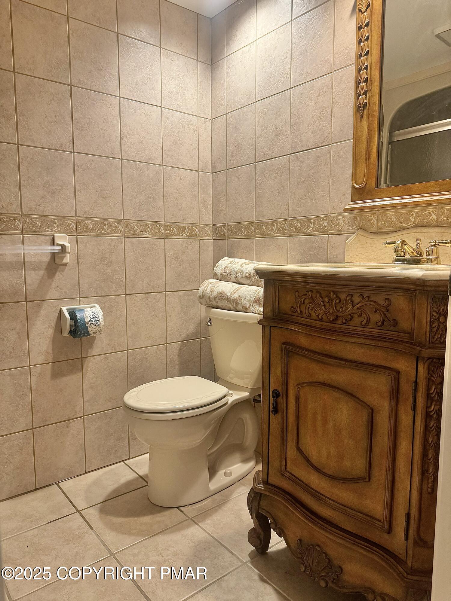 33 Midlake Drive, Unit 101 Lake Harmony, PA 18624 - Photo 4 of 39 a bathroom with a toilet and a sink