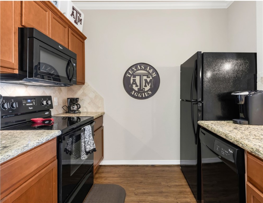 1198 Jones-Butler Road, Unit 1806 College Station, TX 77840 - Photo 16 of 26 a kitchen with a stove and a microwave