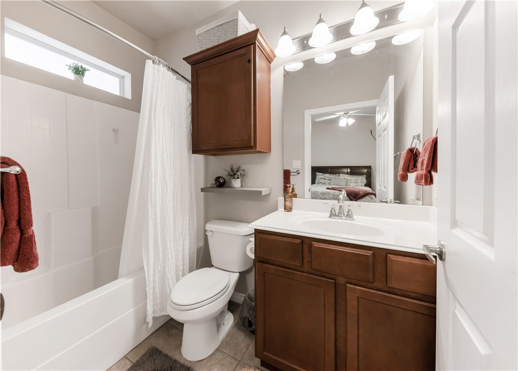 1198 Jones-Butler Road, Unit 1806 College Station, TX 77840 - Photo 23 of 26 a bathroom with a sink a toilet and a mirror