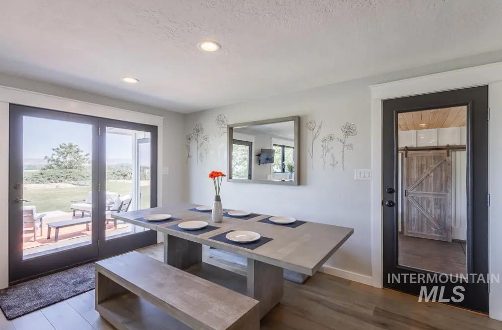 12170 Chinden Rdg Drive Boise, ID 83714 - Photo 12 of 47 Dining room featuring wood finished floors, plenty of natural light, and recessed lighting