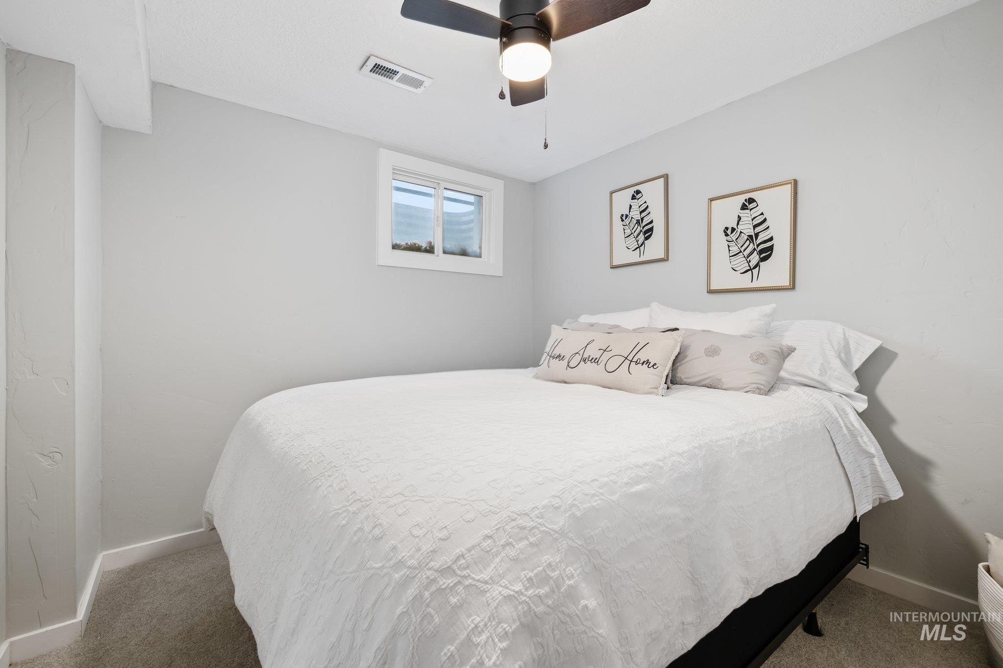 12170 Chinden Rdg Drive Boise, ID 83714 - Photo 31 of 47 Carpeted bedroom with baseboards and a ceiling fan