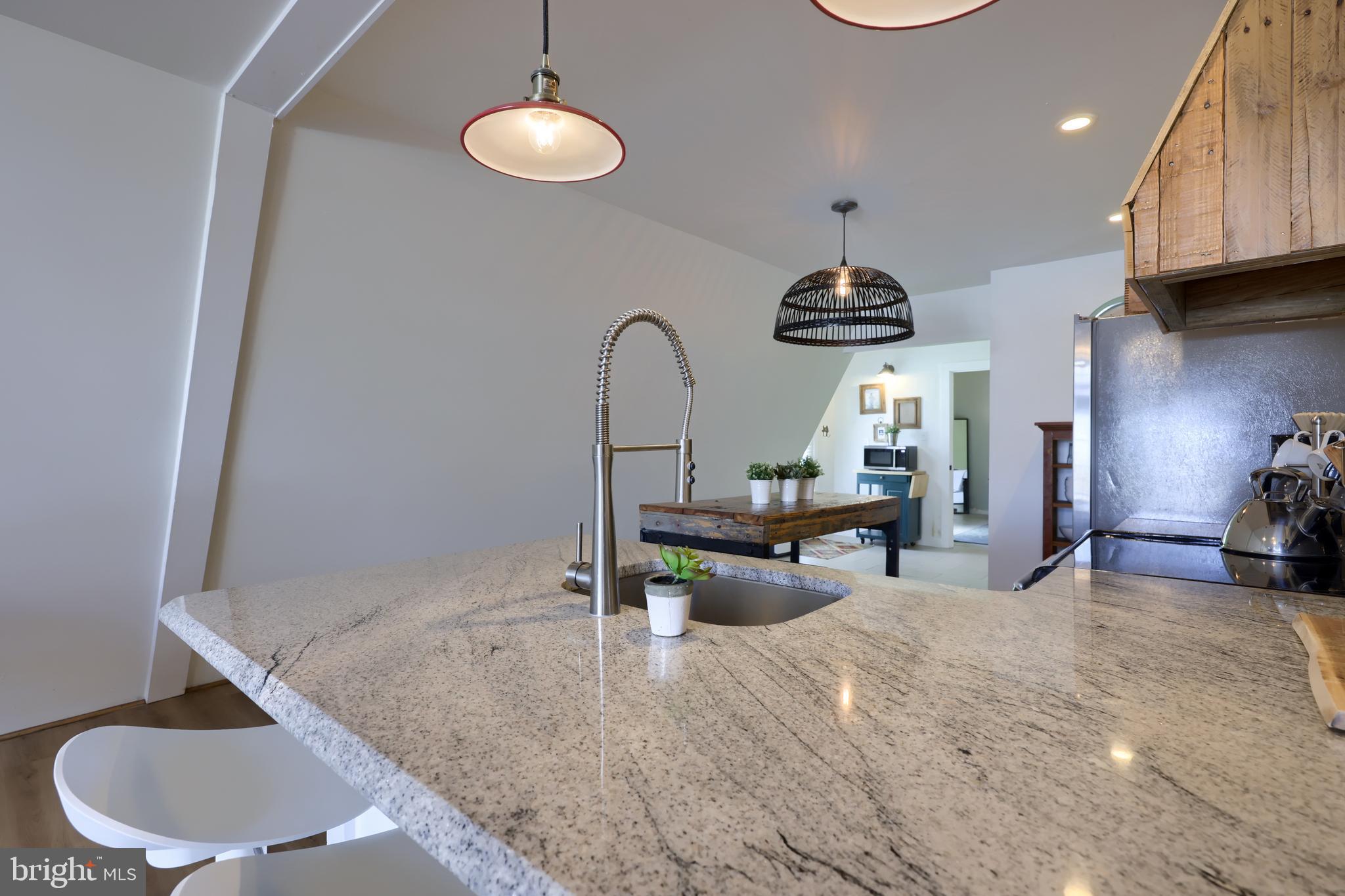 1770 Windy Hill Road Lancaster, PA 17602 - Photo 12 of 43 a living room with furniture a chandelier and kitchen view
