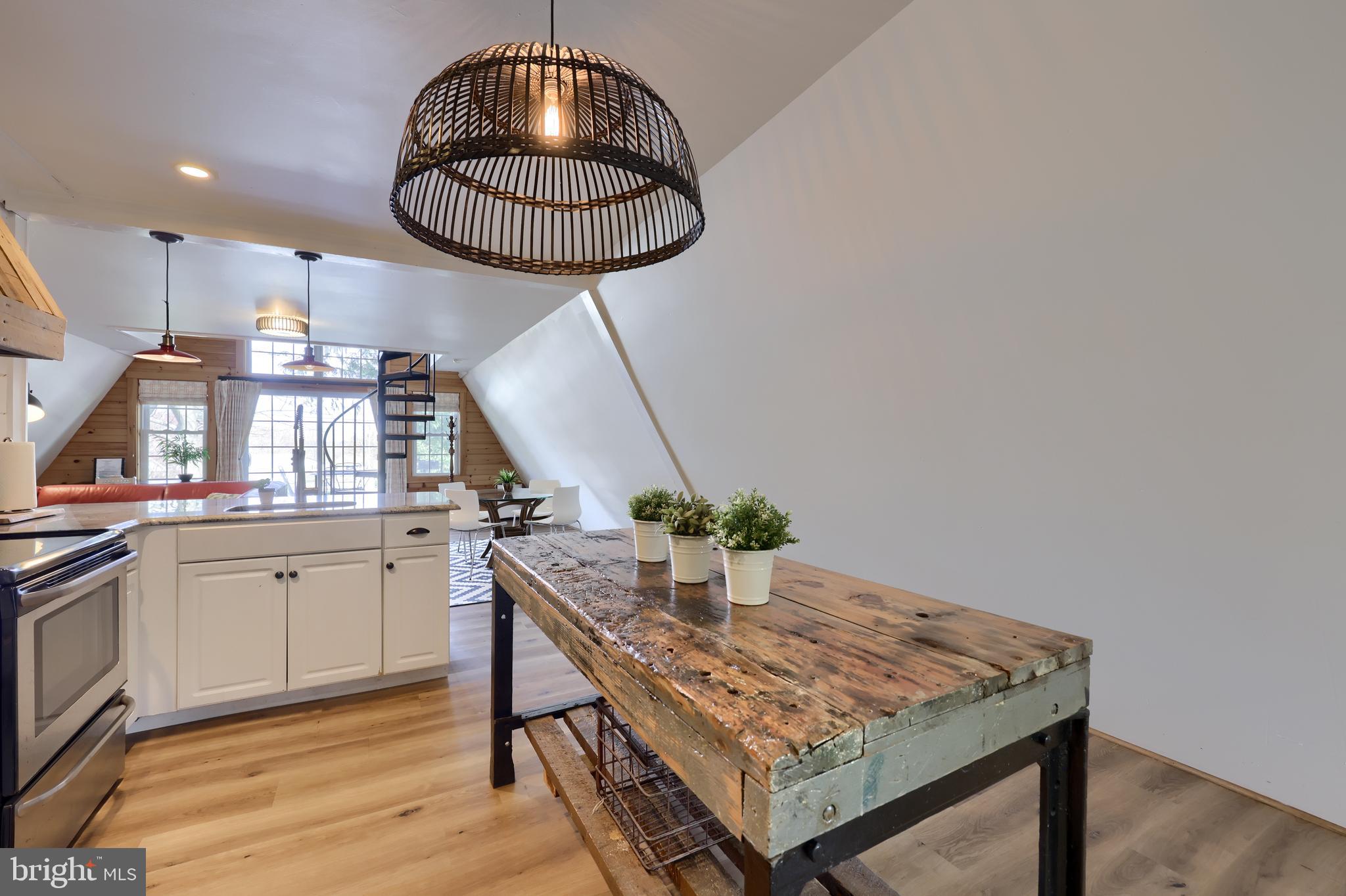 1770 Windy Hill Road Lancaster, PA 17602 - Photo 17 of 43 a kitchen with stainless steel appliances granite countertop a stove a chimney a sink and cabinets