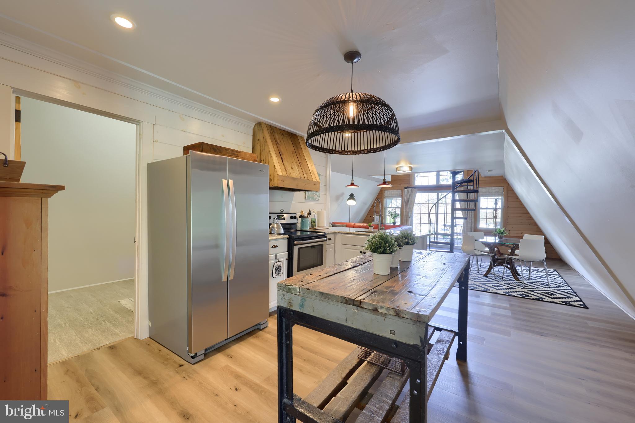 1770 Windy Hill Road Lancaster, PA 17602 - Photo 18 of 43 a view of a dining room with furniture a chandelier and wooden floor