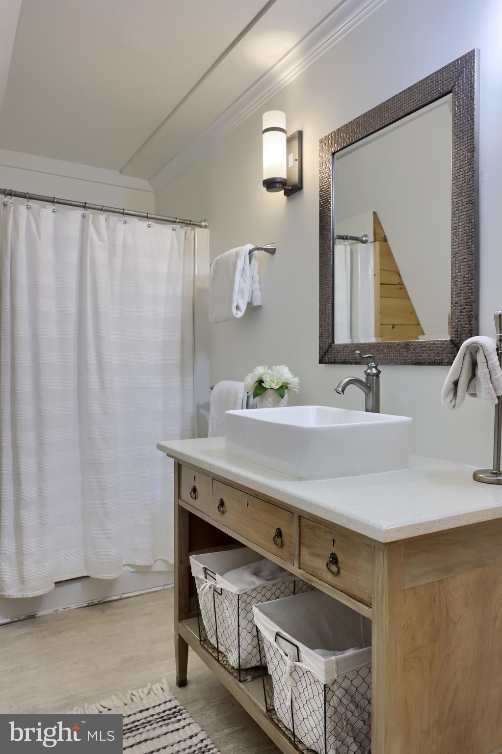 1770 Windy Hill Road Lancaster, PA 17602 - Photo 20 of 43 a bathroom with a sink and a mirror