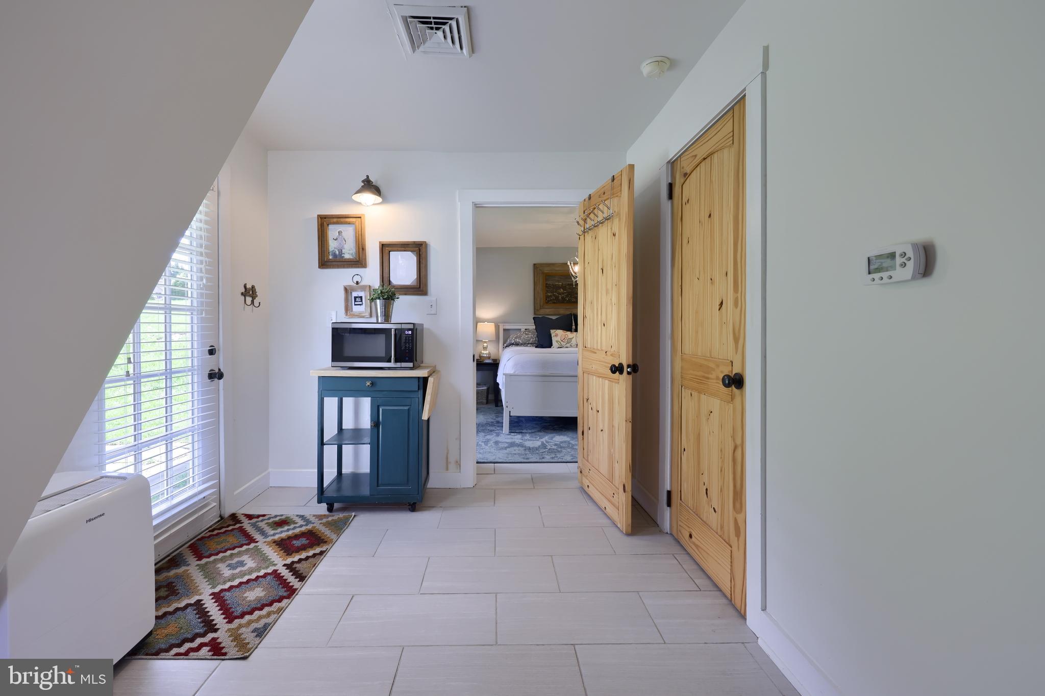 1770 Windy Hill Road Lancaster, PA 17602 - Photo 21 of 43 a view of a hallway with furniture and a livingroom