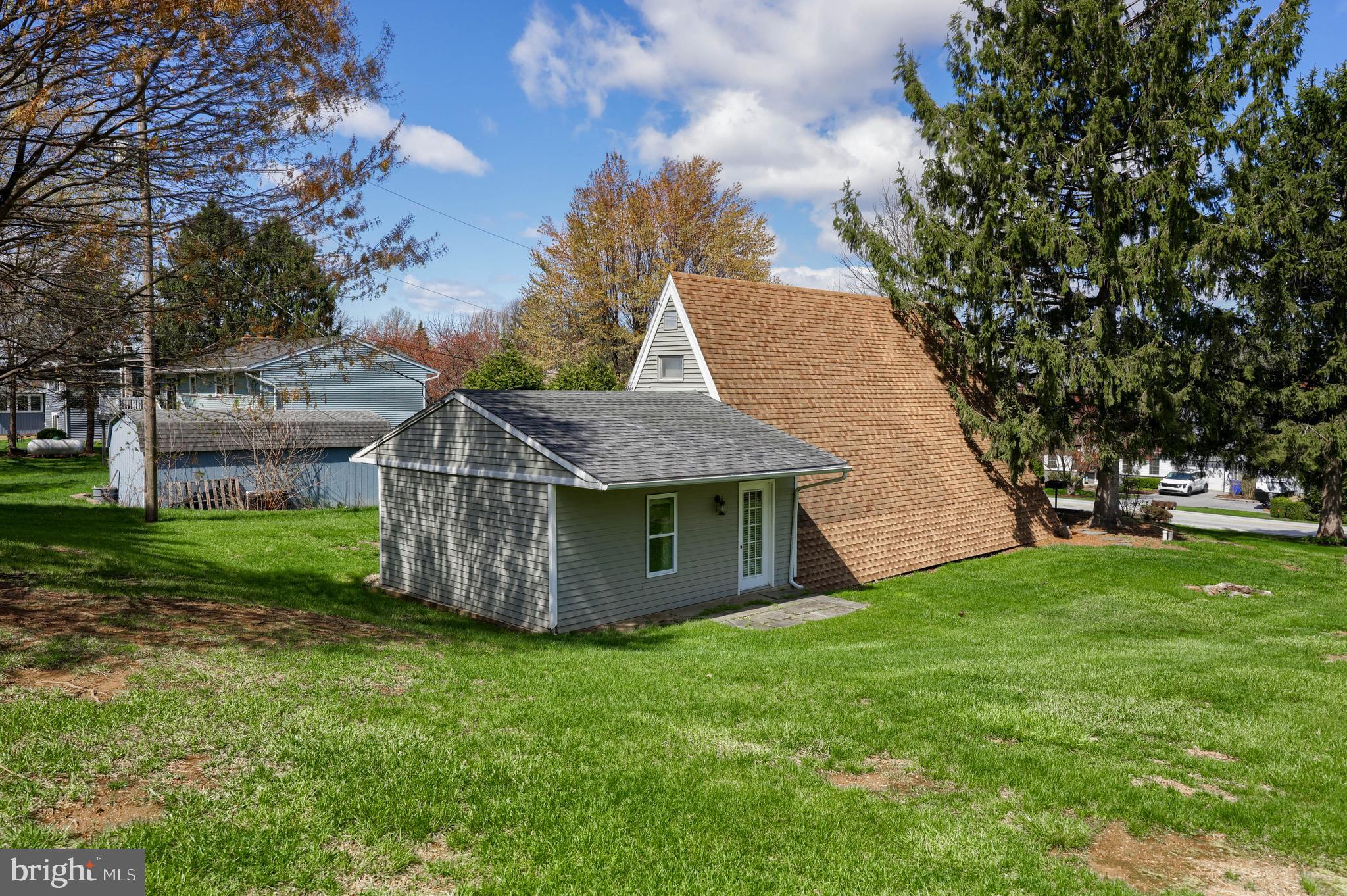 1770 Windy Hill Road Lancaster, PA 17602 - Photo 41 of 43 a view of a barn with big yard potted plants and large tree