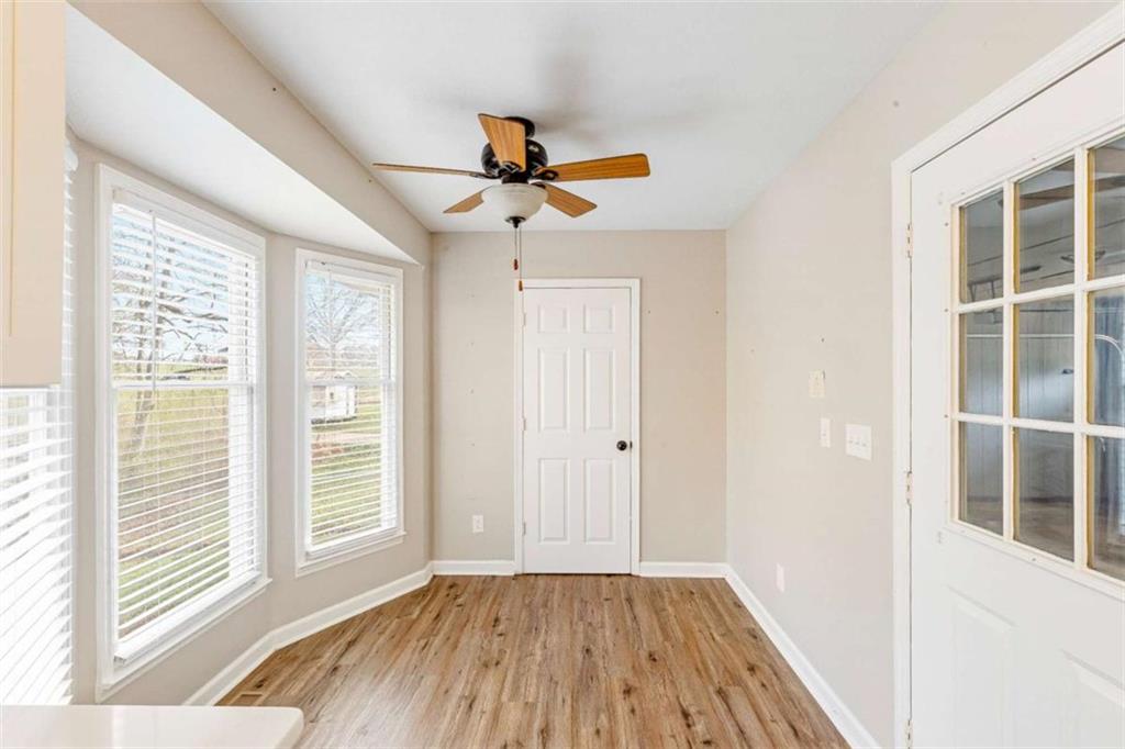 616 Wells Road Buchanan, GA 30113 - Photo 20 of 44 a view of empty room with wooden floor and fan