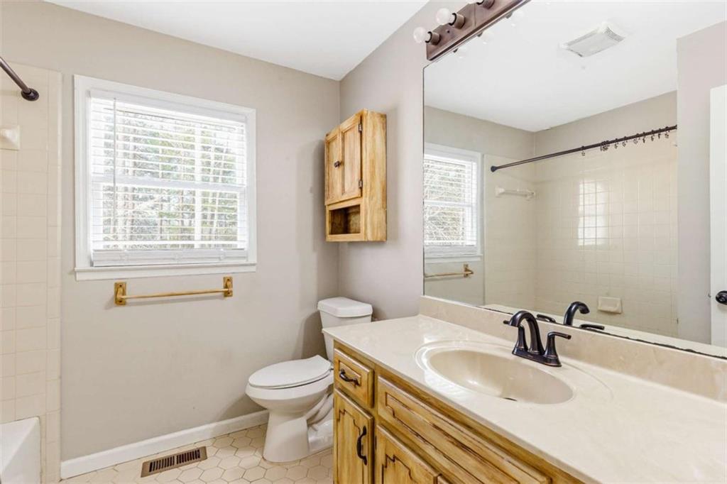 616 Wells Road Buchanan, GA 30113 - Photo 24 of 44 a bathroom with a sink a toilet and a mirror