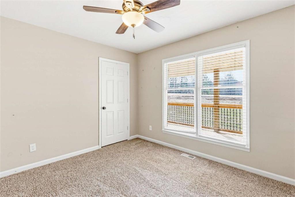 616 Wells Road Buchanan, GA 30113 - Photo 25 of 44 a view of an empty room with a window