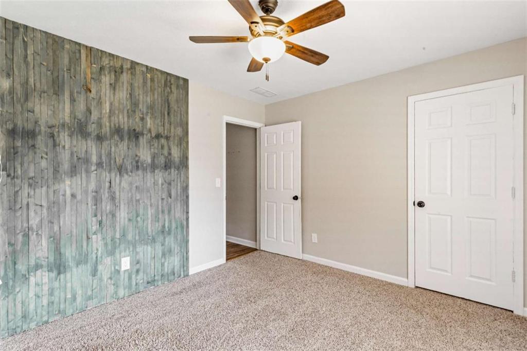 616 Wells Road Buchanan, GA 30113 - Photo 28 of 44 a view of a room with a ceiling fan and a shower