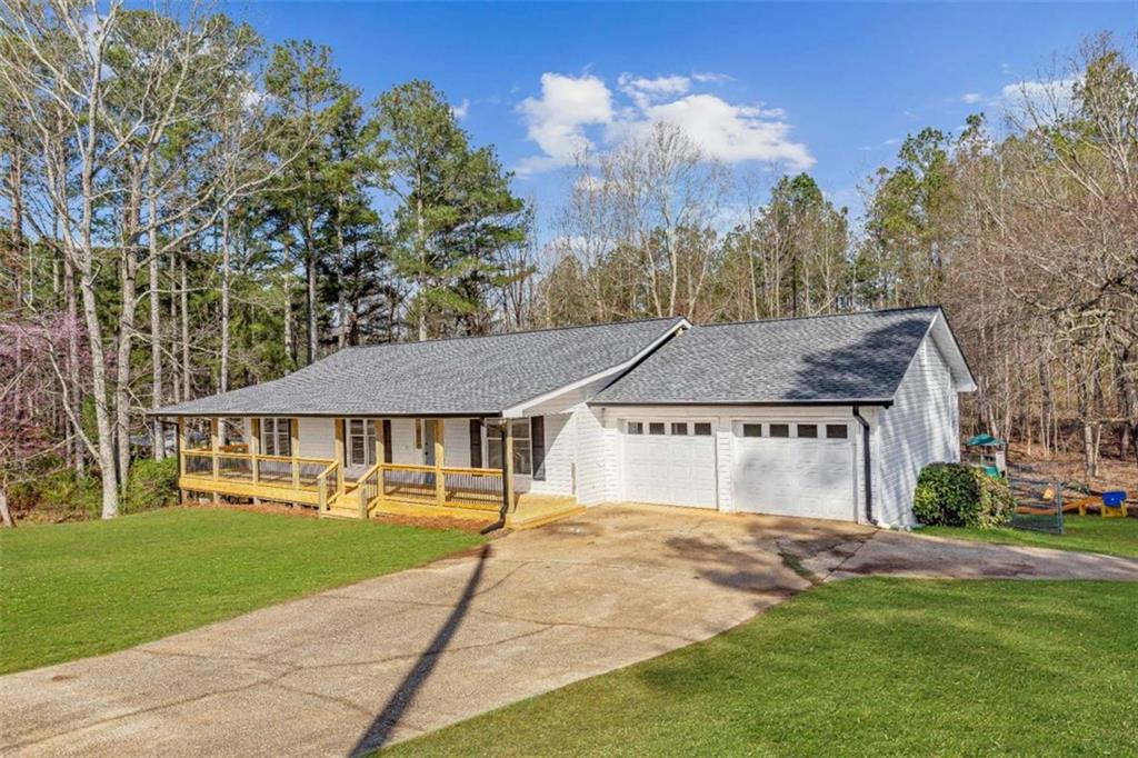 616 Wells Road Buchanan, GA 30113 - Photo 3 of 44 a view of house with yard and green space