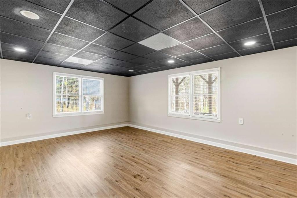 616 Wells Road Buchanan, GA 30113 - Photo 36 of 44 a view of an empty room with wooden floor and a window