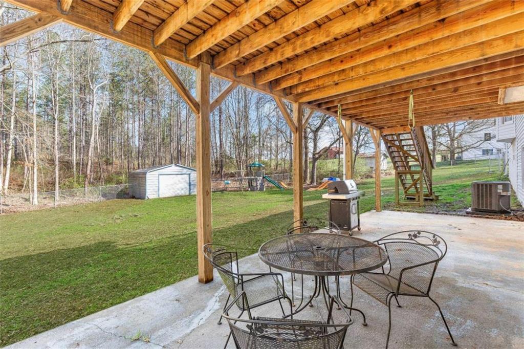 616 Wells Road Buchanan, GA 30113 - Photo 39 of 44 a patio with garden area and patio