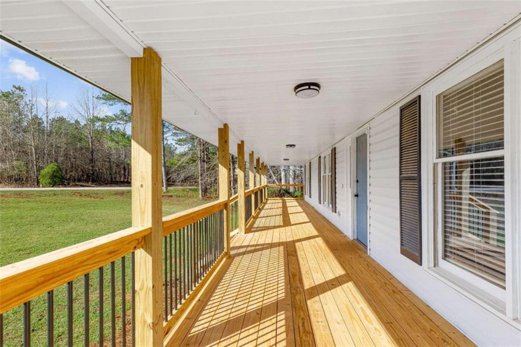 616 Wells Road Buchanan, GA 30113 - Photo 4 of 44 a view of balcony with wooden floor and fence
