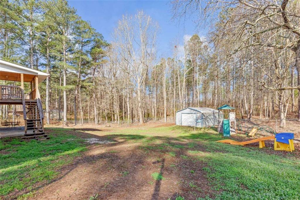 616 Wells Road Buchanan, GA 30113 - Photo 44 of 44 a view of a park with swings and slides