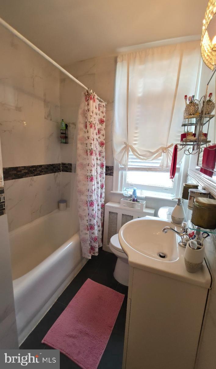 4113 Comly Street Philadelphia, PA 19135 - Photo 20 of 21 a bathroom with a sink a toilet and a bathtub