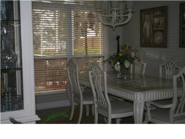 2188 Bay Grove Road Freeport, FL 32439 - Photo 3 of 23 a kitchen area with table and chairs
