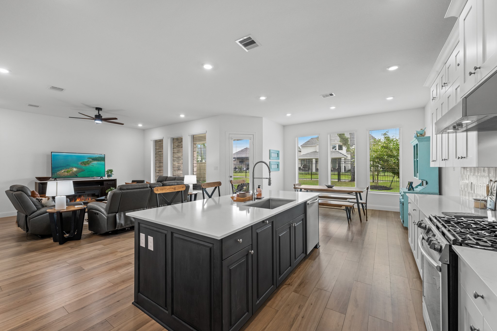 22014 Gateway Arch Drive Porter, TX 77365 - Photo 11 of 27 a large kitchen with lots of counter top space a sink a stove and wooden floor
