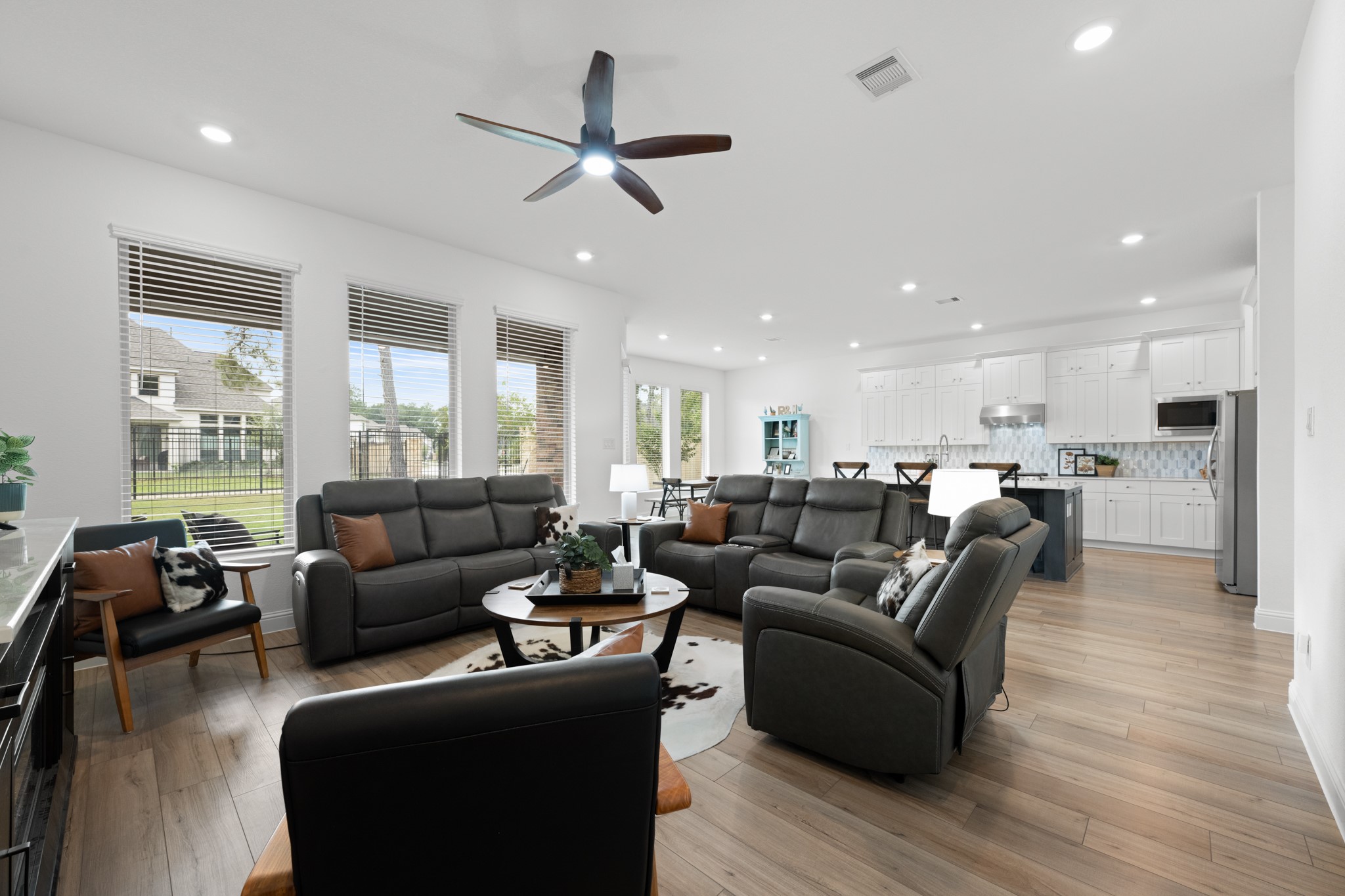 22014 Gateway Arch Drive Porter, TX 77365 - Photo 13 of 27 a living room with furniture kitchen area and a wooden floor