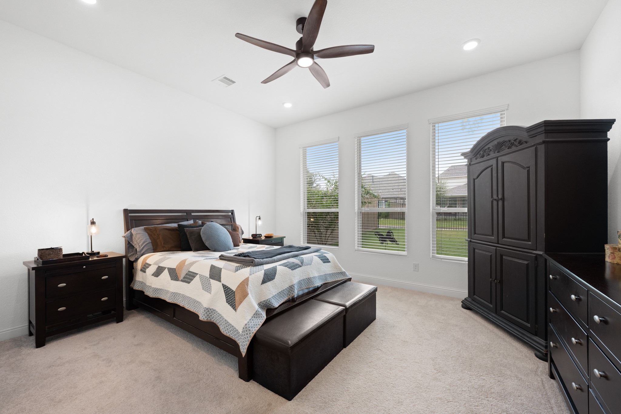 22014 Gateway Arch Drive Porter, TX 77365 - Photo 15 of 27 a bedroom with a bed flat screen tv and a large window
