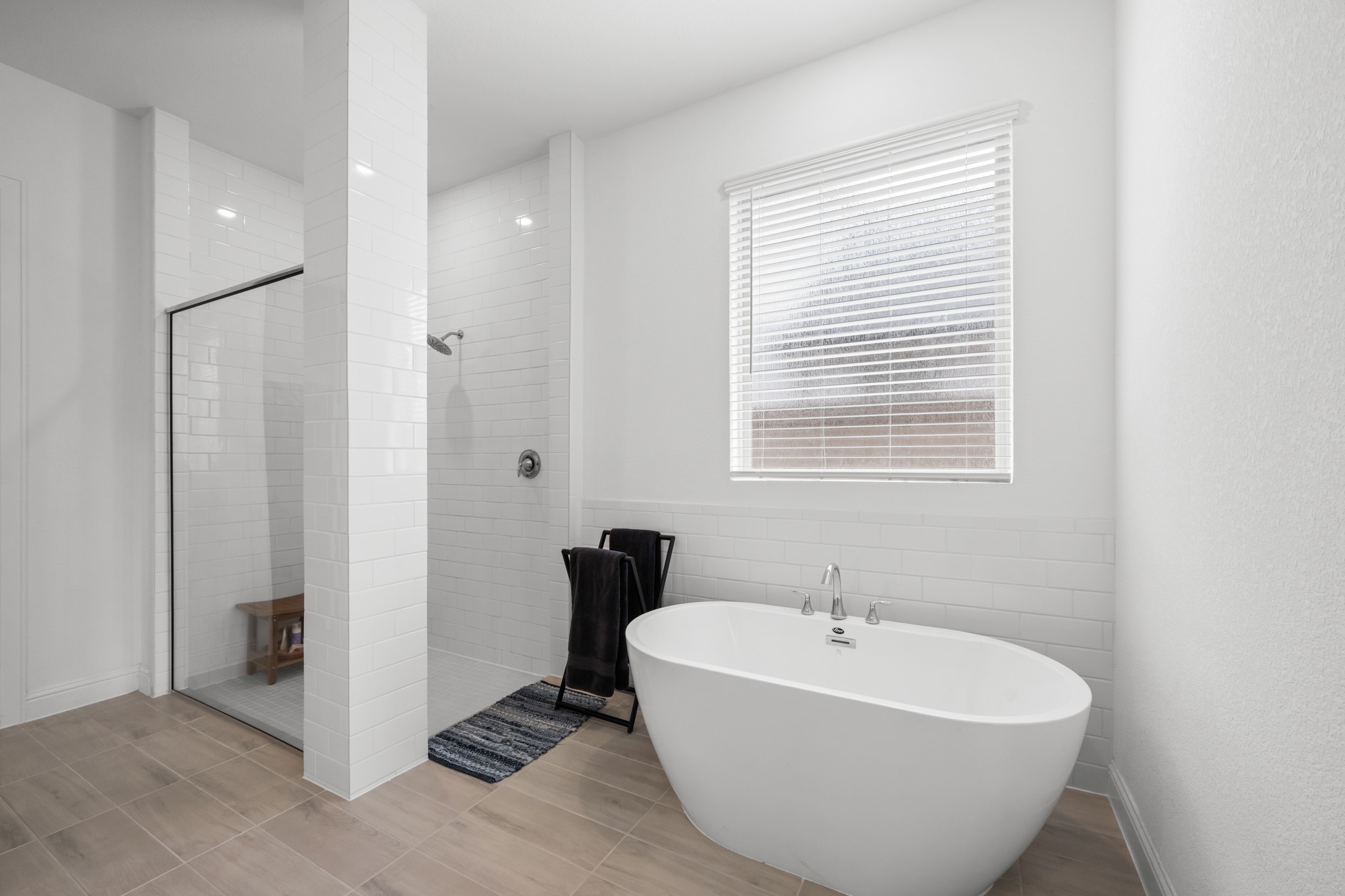 22014 Gateway Arch Drive Porter, TX 77365 - Photo 17 of 27 a white bath tub sitting next to a bathroom sink