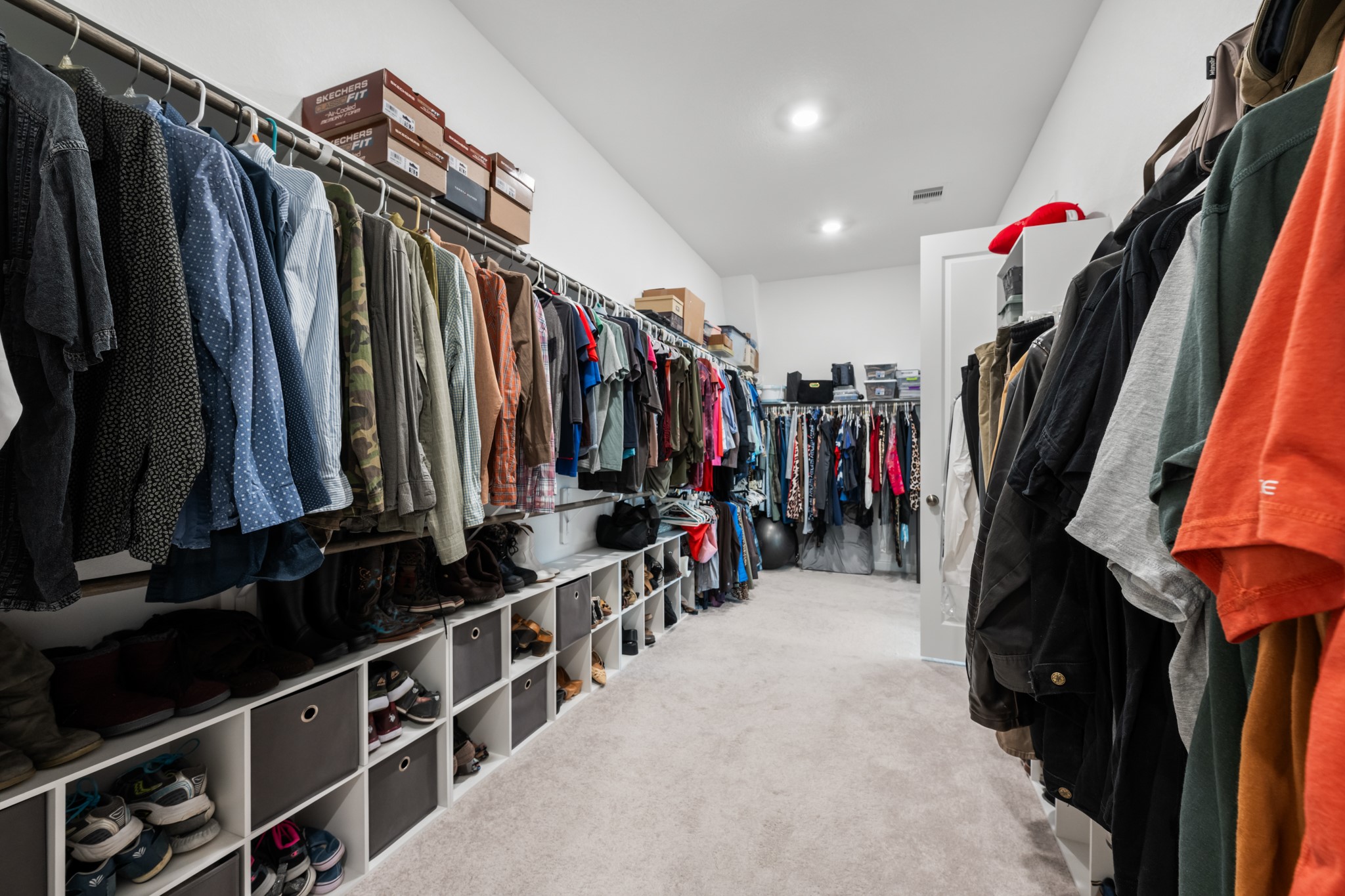 22014 Gateway Arch Drive Porter, TX 77365 - Photo 18 of 27 a view of walk in closet with clothes and shoes