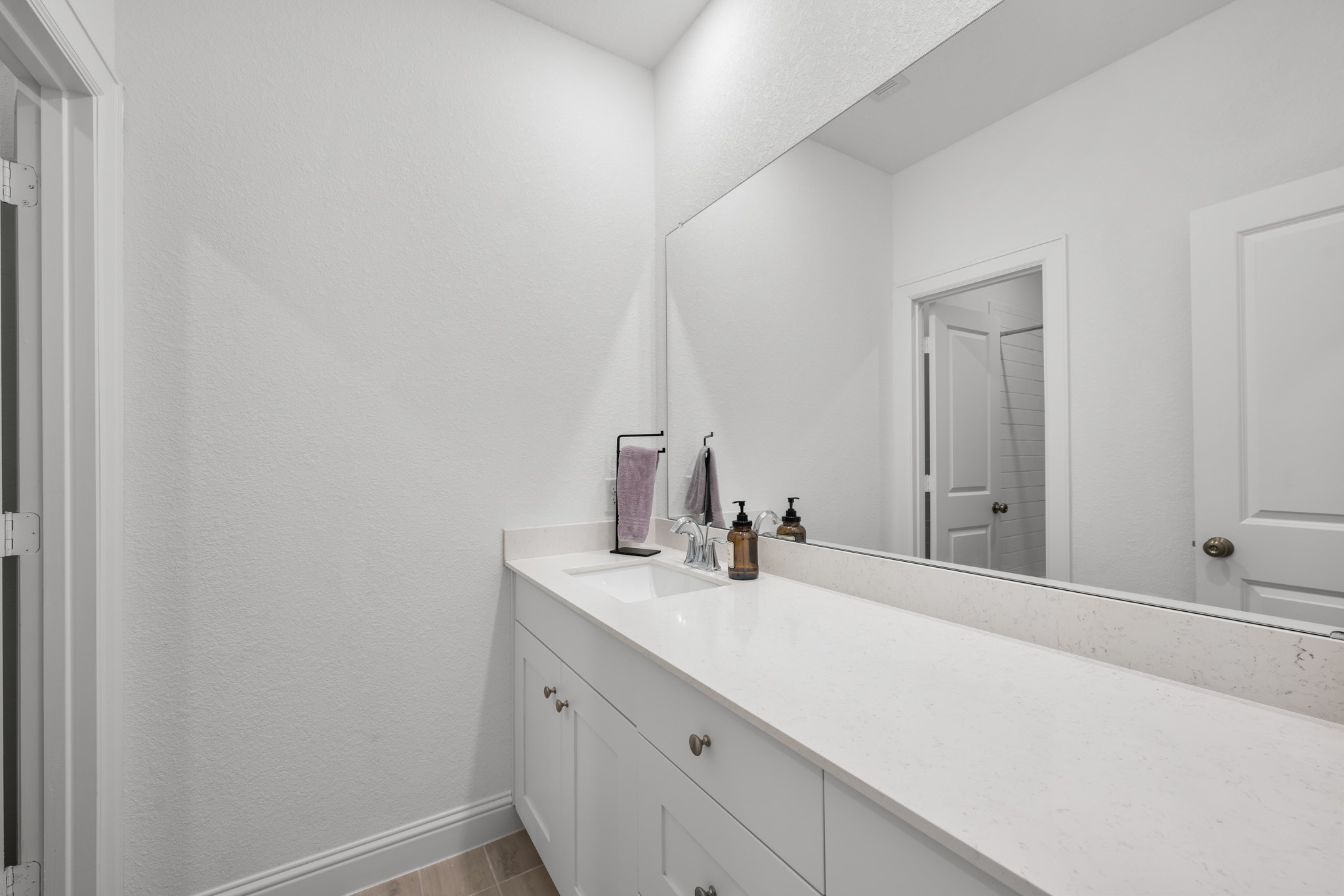 22014 Gateway Arch Drive Porter, TX 77365 - Photo 22 of 27 a bathroom with a sink and a mirror