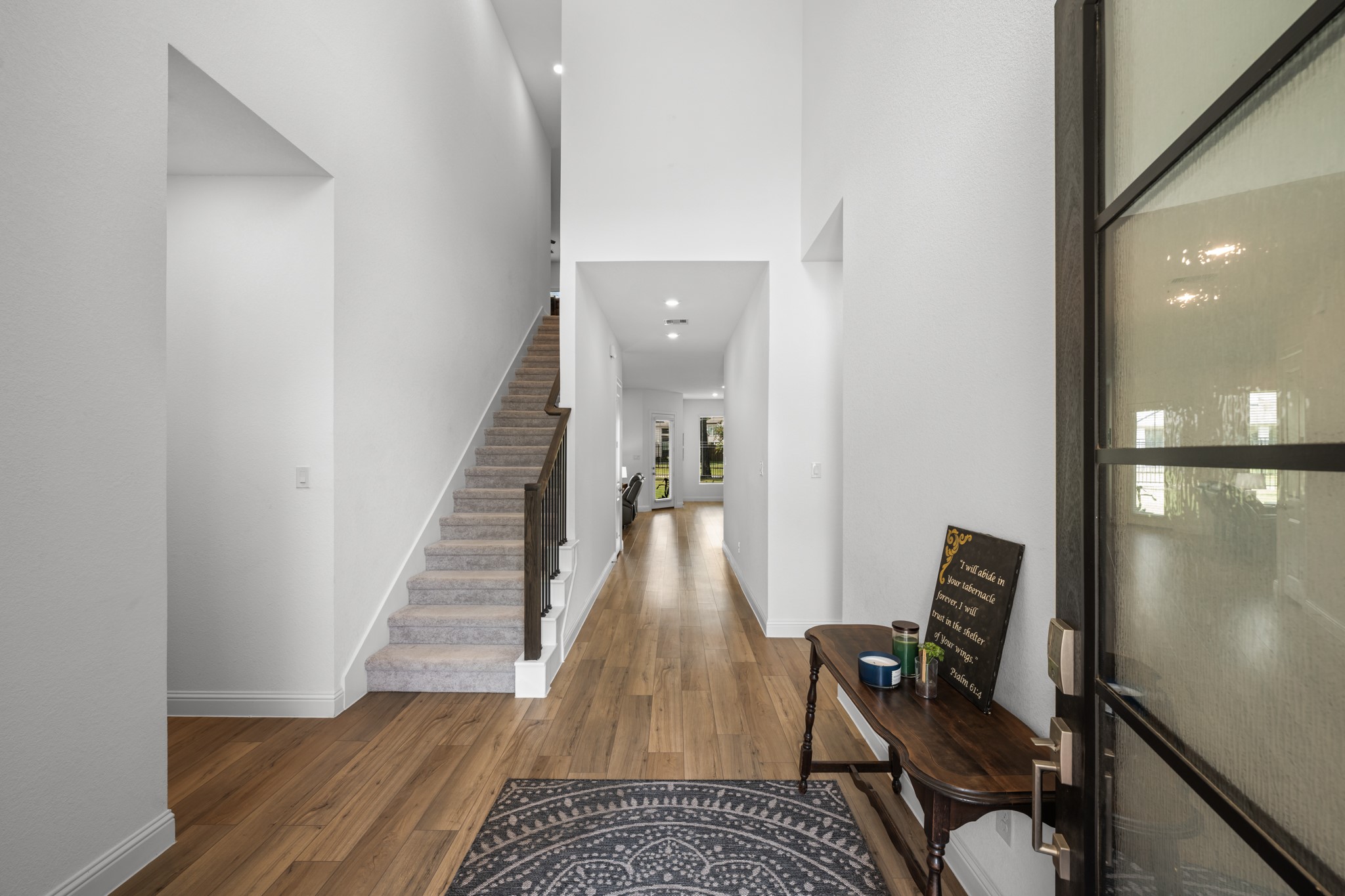 22014 Gateway Arch Drive Porter, TX 77365 - Photo 3 of 27 a view of a hallway with wooden floor and a living room