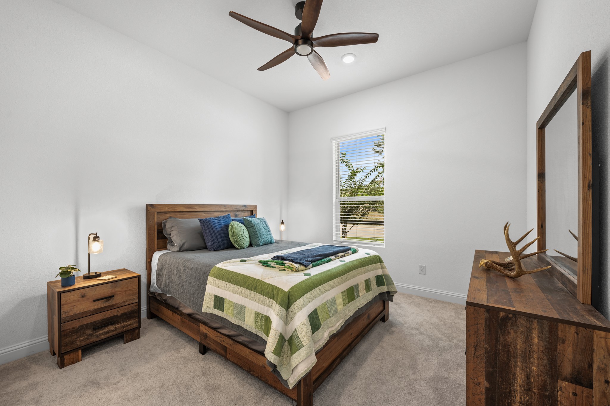 22014 Gateway Arch Drive Porter, TX 77365 - Photo 6 of 27 a bedroom with a bed and a flat tv screen on the dresser