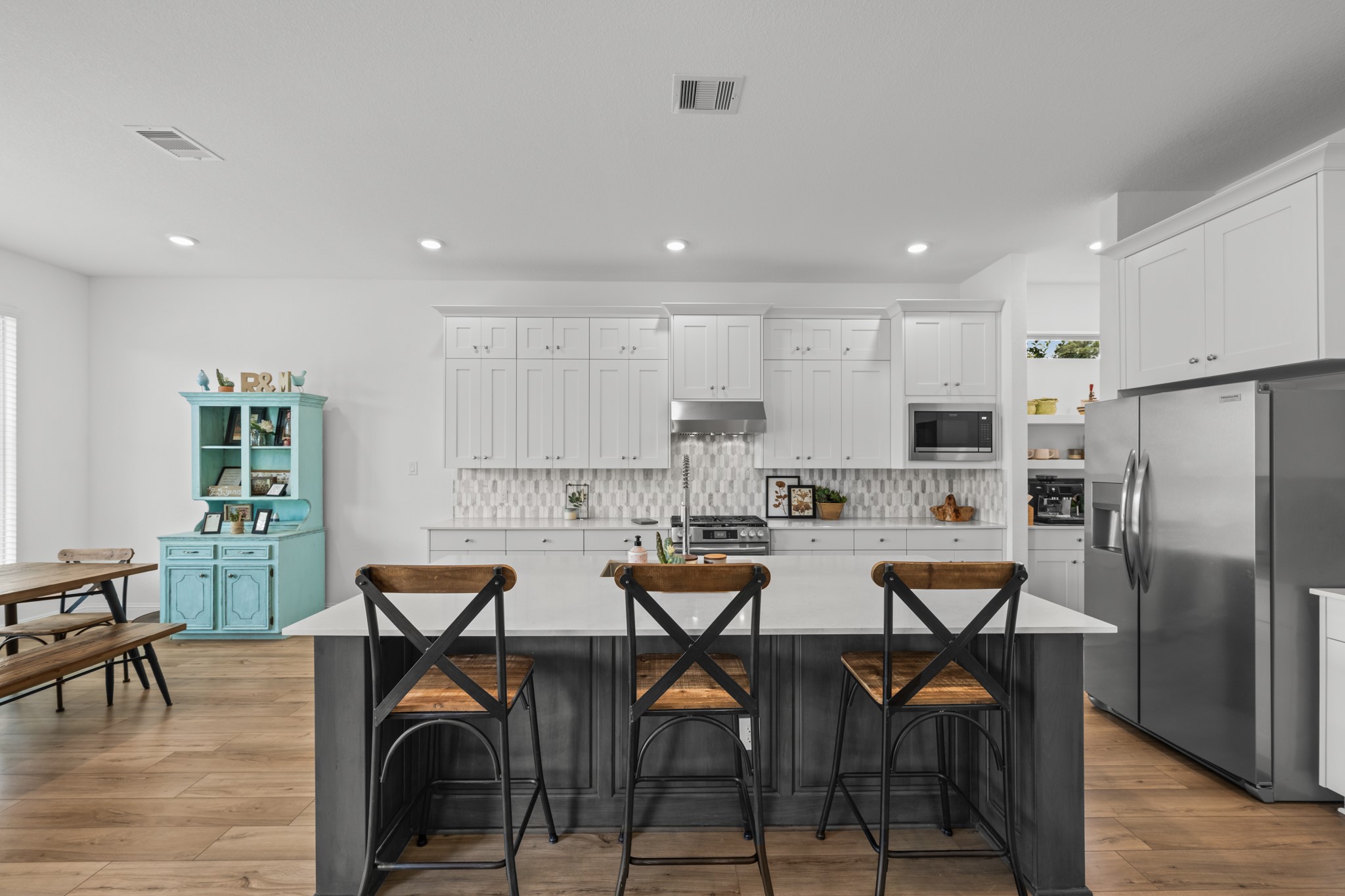 22014 Gateway Arch Drive Porter, TX 77365 - Photo 8 of 27 a kitchen with a table and chairs in it