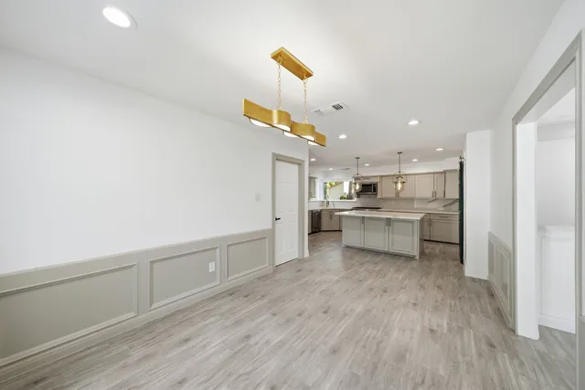 a view of kitchen with wooden floor