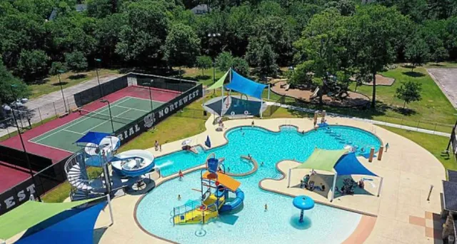 an aerial view of a swimming pool patio and outdoor seating