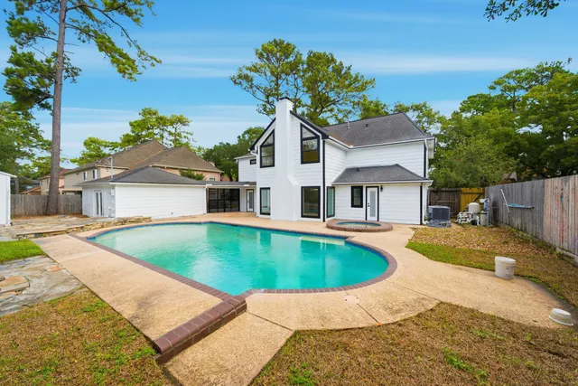 a front view of a house with swimming pool