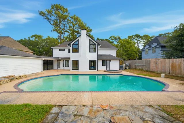 a view of a house with swimming pool