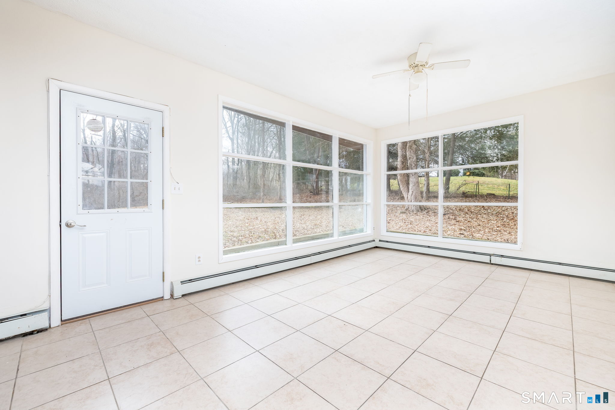 461 Pond Road Franklin, CT 06254 - Photo 6 of 35 a view of an empty room with a window