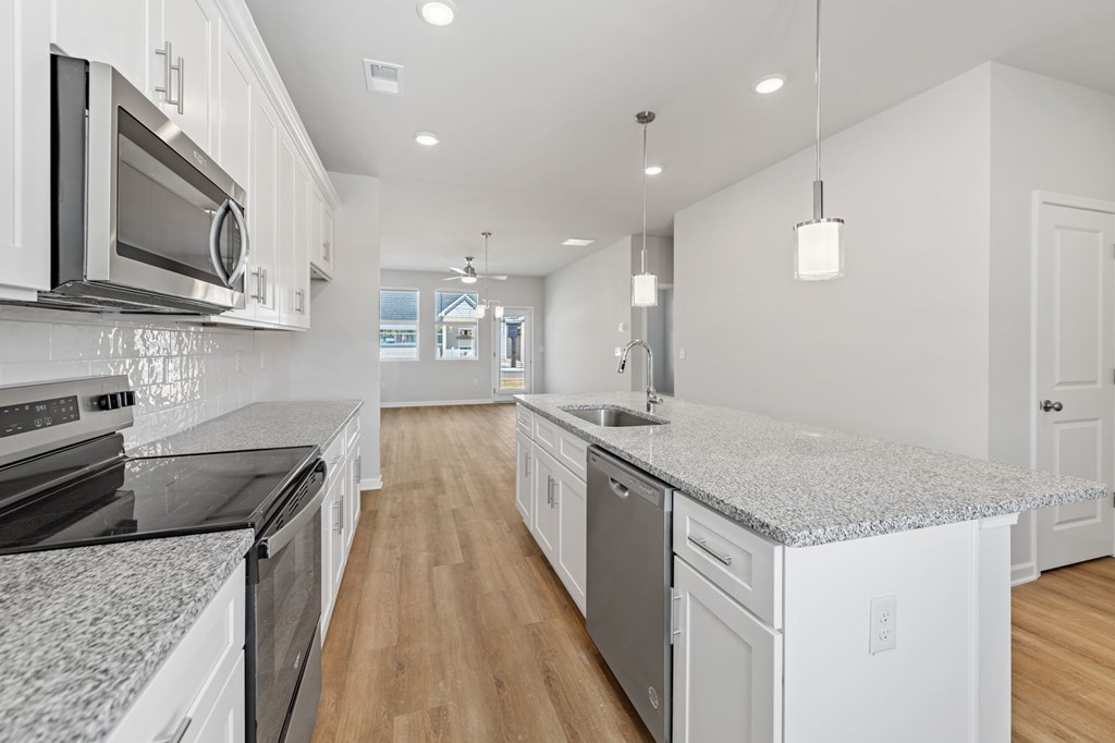 48 Grove Loop Blue Ridge, GA 30513 - Photo 17 of 27 a kitchen with stainless steel appliances granite countertop a sink stove and microwave