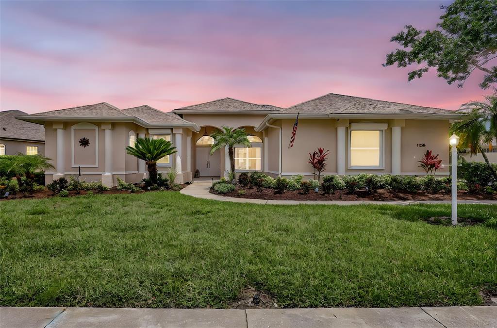 11328 Rivers Bluff Circle Lakewood Ranch, FL 34202 - Photo 1 of 1 a front view of a house with a yard and garage
