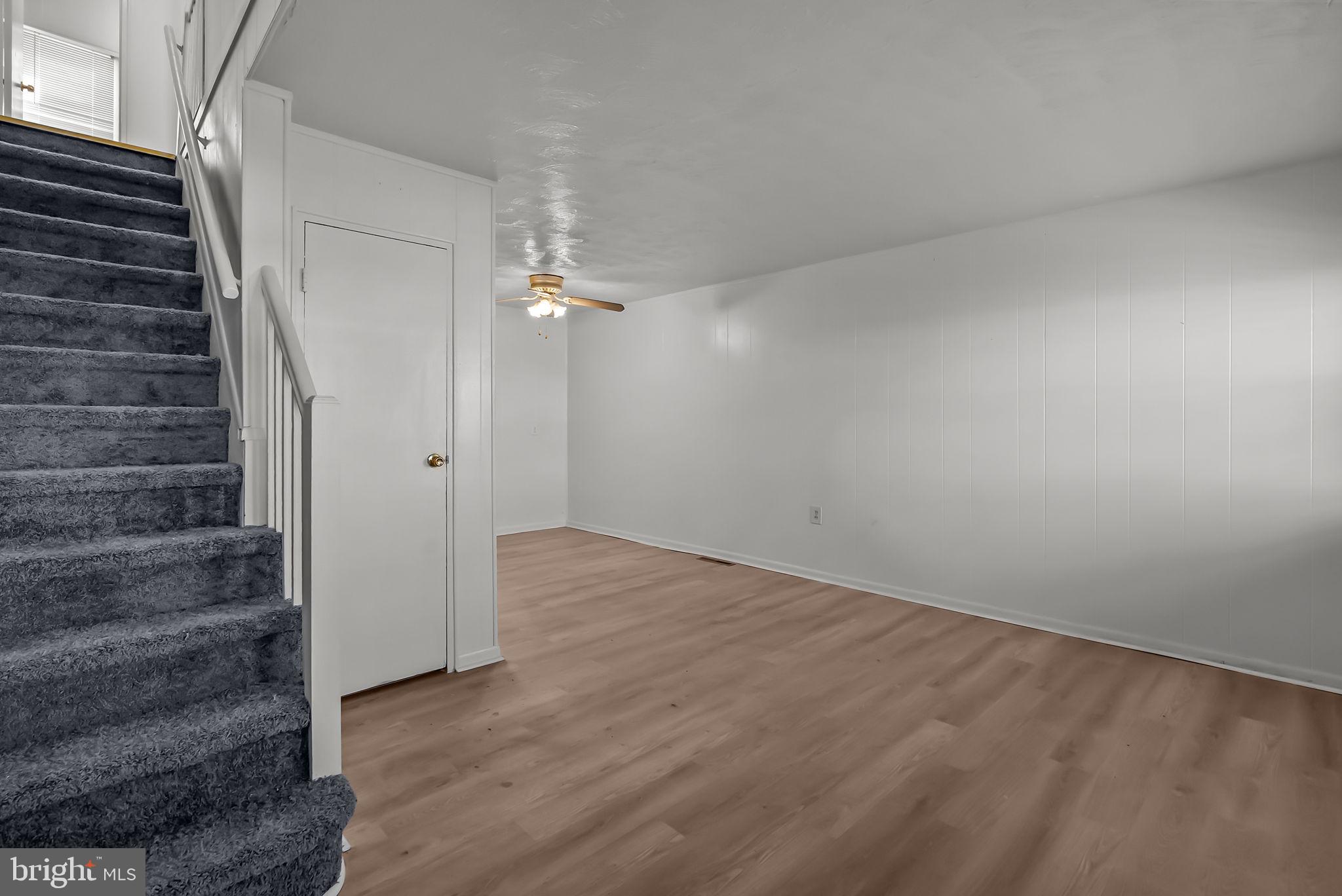 5708 Mitchell Road Levittown, PA 19057 - Photo 17 of 23 a view of an empty room with stairs and ventilation