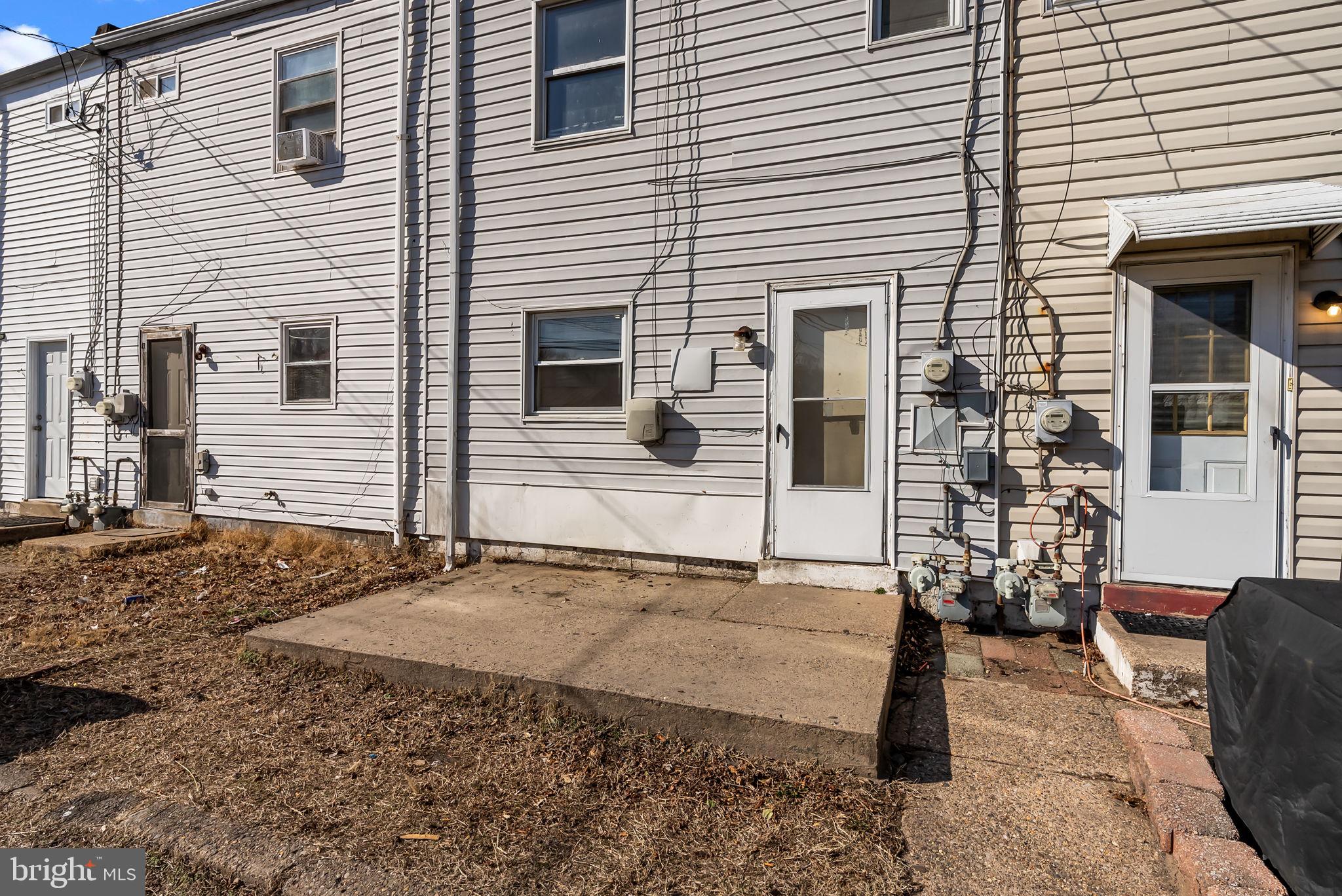 5708 Mitchell Road Levittown, PA 19057 - Photo 8 of 23 a view of a house with a patio