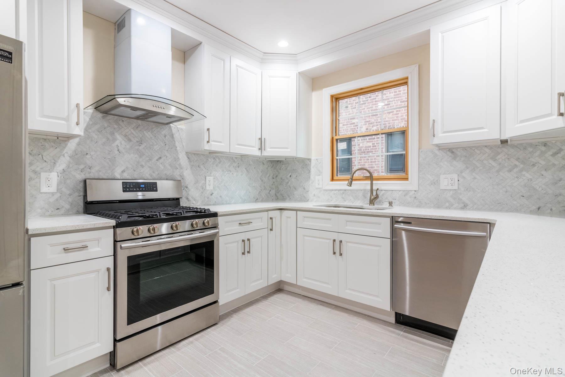 84-31 Beverly Road Queens, NY 11415 - Photo 12 of 22 Gorgeous Alpine White Chef's kitchen with Stainless Steel Appliances- Tremendous Set Up!