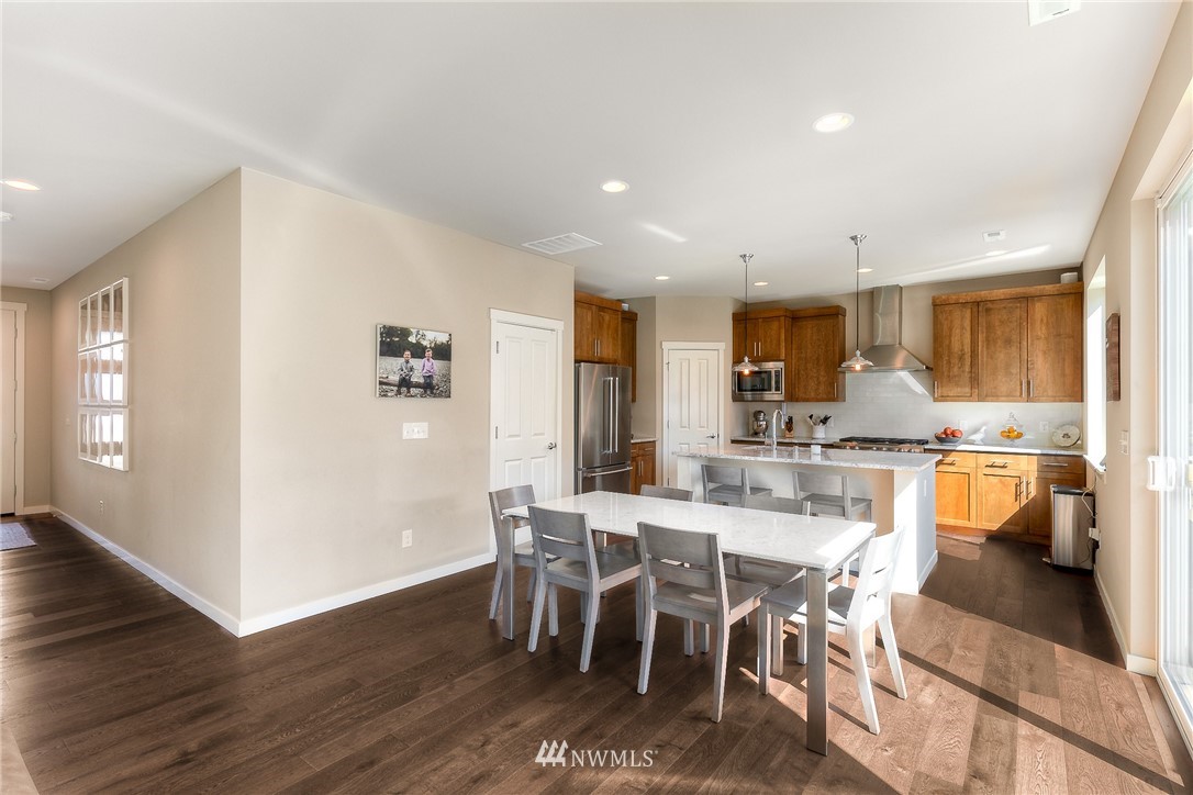 26 175th Place Southwest Bothell, WA 98012 - Photo 11 of 27 a view of a dining room with furniture and wooden floor