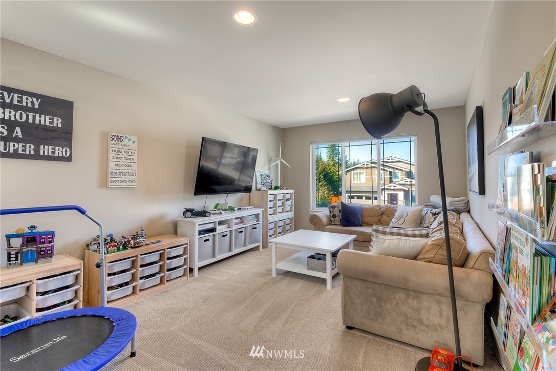 26 175th Place Southwest Bothell, WA 98012 - Photo 12 of 27 a living room with furniture and a flat screen tv