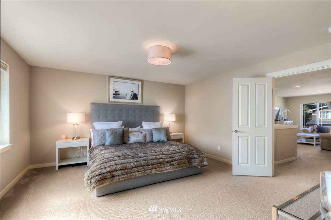 26 175th Place Southwest Bothell, WA 98012 - Photo 16 of 27 a bedroom with a bed and painting on the wall