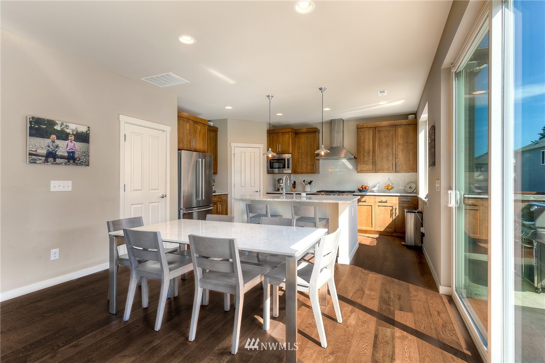 26 175th Place Southwest Bothell, WA 98012 - Photo 9 of 27 a view of a dining room with furniture and a chandelier
