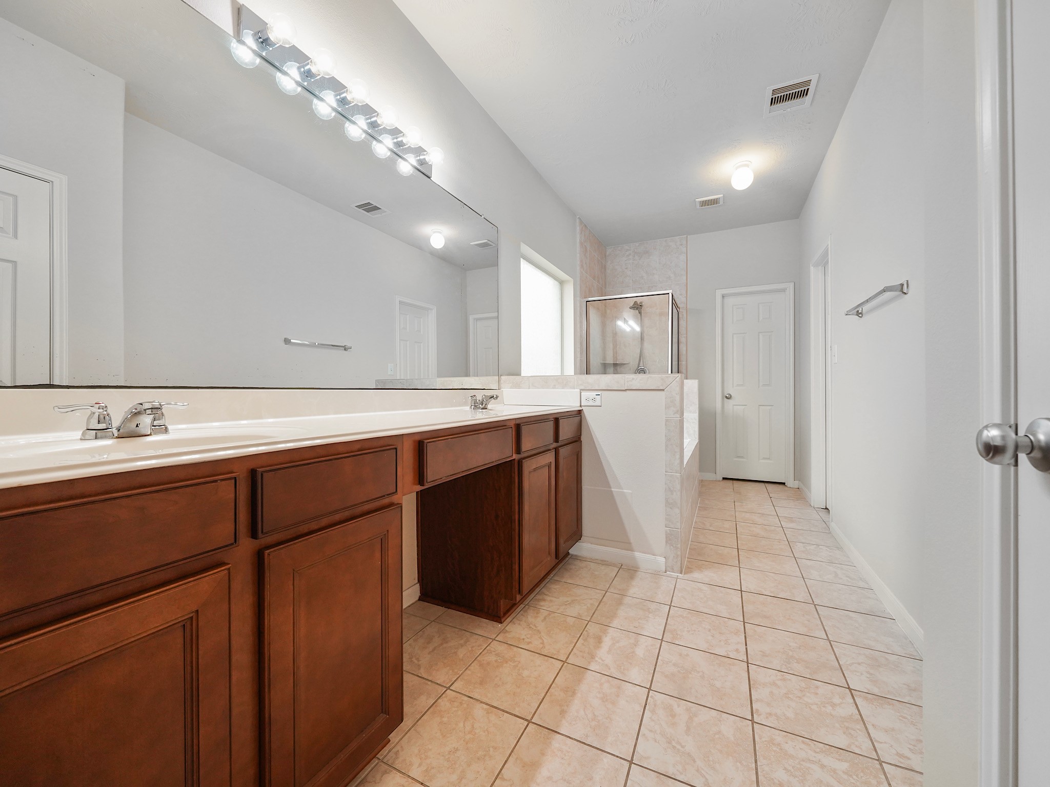 3218 Bandera Run Lane Katy, TX 77494 - Photo 11 of 15 Gorgeous ensuite bathroom is the perfect relaxation space after a long day. Includes: dual sinks, vanity area, soaking tub and separate shower!