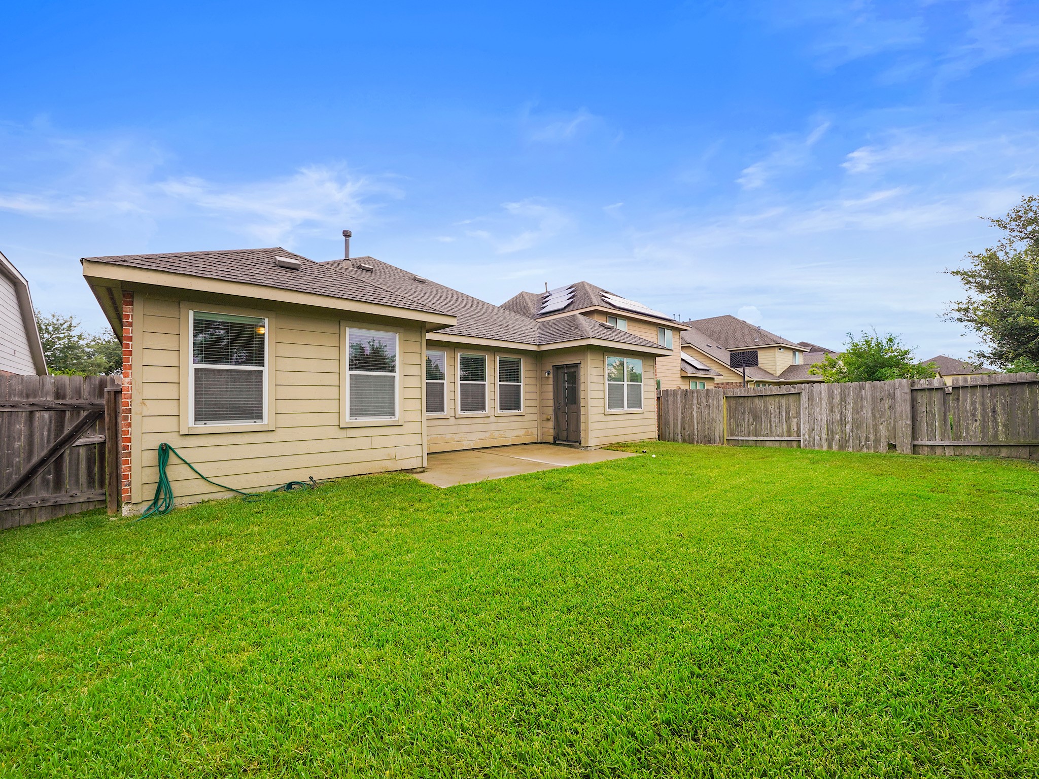 3218 Bandera Run Lane Katy, TX 77494 - Photo 15 of 15 Expansive backyard features patio for outdoor furniture and plenty of space for outdoor activities.