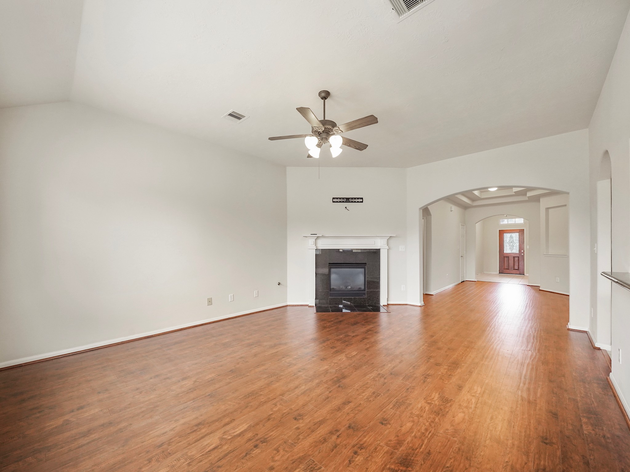 3218 Bandera Run Lane Katy, TX 77494 - Photo 3 of 15 Spacious living room features a gaslog fireplace focal point!