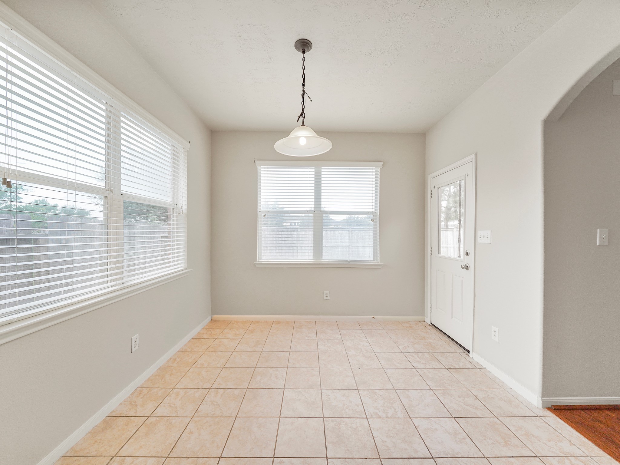 3218 Bandera Run Lane Katy, TX 77494 - Photo 8 of 15 Inviting breakfast nook with abundant sunlight, ideal for cozy gatherings. Enjoy the views through the surrounding windows.
